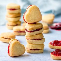 a stack of cookies with jam on them