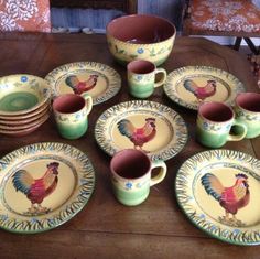 a table topped with lots of plates and cups