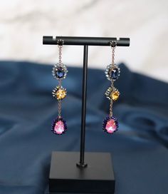 Material:  Hand Crafted Bead Stations, Titanium Post, Flawer Charms, Lead & Nickel Free Length: 3 1/8” Width: 3/4” Blue Stone Necklace, Cat Enclosure, Earring Ideas, Gold Earrings Designs, Pink Beads, Dangling Earrings, Blue Necklace, Flower Charm, Blue Beads