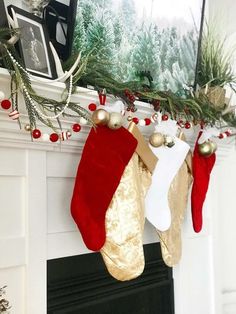 christmas stockings hanging from the mantel in front of a fireplace