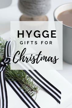 a gift wrapped in black and white ribbon with the words hygge gifts for christmas