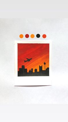 an airplane is flying in the sky over a cityscape with orange, black and red colors