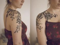 the woman is wearing a dress with flowers on her arm and shoulder, while she has tattoos on her arms