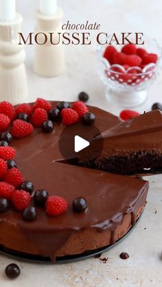 chocolate mousse cake with raspberries and chocolate ganache on the top