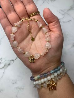 Welcome to my shop! 🦋 If you love handmade genuine crystal jewelry, you are at the right place!  This gorgeous pink rose quartz bracelet is a handmade piece with 6-7mm rose quartz chips, 8mm rose quartz heart shaped beads, (2mm) 18K gold-plated spacer beads, an 18K Gold-plated butterfly charm, and a18K gold-filled 2inch extender. Rose Quartz is known as the universal stone of love 💗    This beautiful bracelet is approx. 6 1/2 inches in length with an 18K Gold-filled 2inch extender.  Every piece is made to order and usually takes 5-7 business days for production and 1-2 business days to ship.  Every piece is unique due to each stone being slightly different. All beads are genuine crystals.  Each piece is handcrafted with love ♡︎  For best care, keep jewelry pieces dry at all times. All sa Quartz Bracelet Crystal, Gold Rose Quartz Bracelets For Jewelry Making, Gold Bracelets With Rose Quartz And Natural Stones, Handmade Dainty Rose Quartz Beaded Bracelets, Gold Rose Quartz Beaded Bracelets As Gift, Gift Rose Quartz Beaded Bracelets In Gold, Spiritual Gold Beaded Rose Quartz Bracelets, Crystal Chip Jewelry, Chip Jewelry