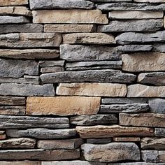 a stone wall that is made out of various types of stones