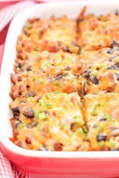 a casserole dish with cheese and black beans