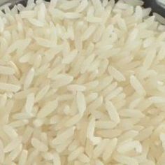 white rice is in a bowl on the table