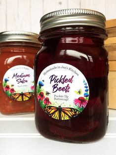 two jars of pickled beets sit on a shelf