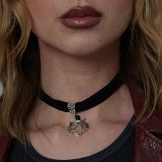 Experience the allure of the Gothic Velvet Pentagram Choker Necklace. Crafted in soft velvet, this choker features a striking pentagram design that adds a touch of mystery and charm.  Good to Know: Choker with Adjuster  Black Velvet Choker with large Silver Plated Pentagram charm  Pendant size: 1.7 x 1.25 in Sizing Choker - 12-14" (Extendable) Pentagram Choker, Gothic Choker Necklace, Pentagram Design, Silver Star Earrings, Charm Choker Necklace, Black Velvet Choker, Snake Ring Silver, Lock Necklace, The Gothic