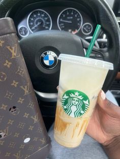 Hand holding a Starbucks caramel iced coffee in front of a BMW steering wheel, blending coffee love with a luxury feel Iced Coffee From Starbucks, Coffee From Starbucks, Caramel Iced Coffee, Caramel Delights, Starbucks Lovers, Caramel Macchiato, Coffee Addict