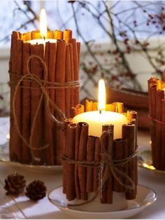 cinnamon sticks wrapped in twine and tied with twine are used as candle holders