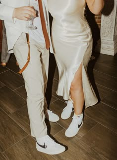 a man and woman dressed in formal wear dancing