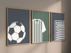 three framed soccer posters on the wall