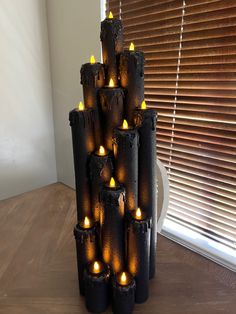 a tower made out of candles on a table