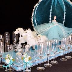 a table topped with wine glasses and a white horse