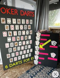 two black and white signs with different types of playing cards on them next to each other