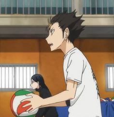 an anime character holding a ball in his hand