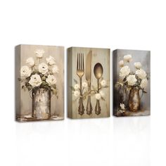 three canvases with white flowers and silverware in vases on the sides, one is