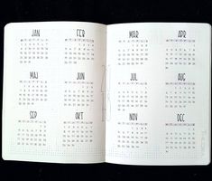 an open calendar book with writing on it