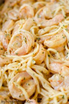 pasta with shrimp and parmesan cheese is ready to be cooked in the oven