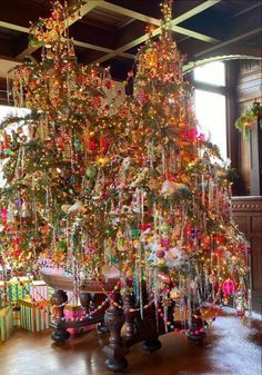 a decorated christmas tree in a large room