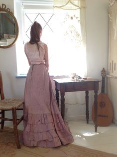 "1890s silk skirt with fully cotton lining waist 56 cm 22\"... the silk has some shredding so this skirt needs great care the bottom has a pink velvet edge I think the closure of this skirt should be at the left front , a bit at the side In that case the back has it's max length: 117 cm 46\" the front has length 107 cm 42\" there is a stain from about 9 cm see the last photo" Victorian Skirt With Ruffles, Vintage Long Skirt With Attached Cancan, Victorian Fitted Skirt With Ruffles, Victorian Ruffled Fitted Skirt, Fitted Victorian Skirt With Ruffles, Victorian Fitted Ruffled Skirt, Victorian Style Fitted Full Skirt, Vintage Silk Long Skirt, Victorian Ruffled Skirt