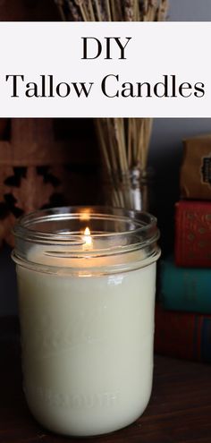 a white candle sitting on top of a wooden table