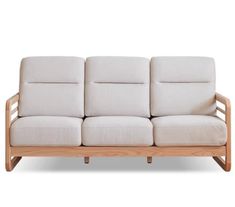 a white couch sitting on top of a wooden frame