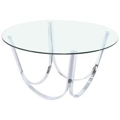 an oval glass table with metal legs