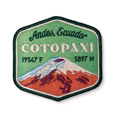 an embroidered patch with the name and image of a mountain in green, red and orange