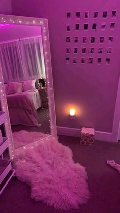 a room with a bed, mirror and lights on the wall in it's corner