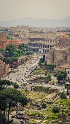 an aerial view of the ancient city of rome, with roman ruins in the foreground