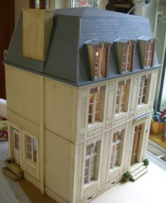 a doll house is sitting on a table