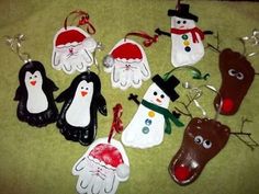 christmas ornaments made to look like penguins and snowmen