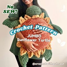 a woman holding a crochet turtle pillow in front of a white background with the words crochet pattern jumbo sunflower turtle