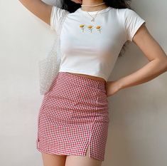 A red and white check gingham print skirt featuring a double split design. There are shorts under the skirt. SIZE CHART Waist Hips Length Small 62 cm 74 cm 39.5 cm Medium 66 cm 88 cm 40.5 cm Large 70 cm 92 cm 41.5 cm