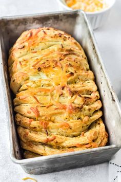 a loaf of bread sitting in a pan on top of a table