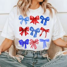 White Sublimation Print Top For 4th Of July, Red Americana T-shirt For 4th Of July, 4th Of July Casual T-shirt With Sublimation Print, Patriotic American Flag Print T-shirt For 4th Of July, Patriotic Sublimation Print T-shirt For 4th Of July, Trendy Bows, All American Girl, Blue Bow