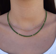 Green jade gemstone beaded necklace Made with smooth 4mm jade beads and 14k solid yellow gold beads and clasp. Please select your prefered length before checkout This minimalist necklace can be worn short as a chocker or longer alone or layered with other necklaces  **Please note the necklace on the model is 3mm.the necklace You will get is 4mm. Measures: 4mm  jade smooth beads 4 solid gold beads 2.5mm  6mm spring ring clasp 100% 14k solid gold hallmarked on clasp *if you prefer a fish lock clasp please convo me :) Runway Jewelry, Jade Bead Necklace, Dangle Earrings Wedding, Green Beaded Necklace, Beaded Necklace Designs, Pearl Earrings Wedding, Jade Gemstone, Gemstone Beaded Necklace, Jade Necklace