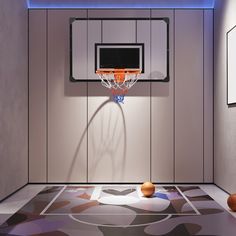 a basketball hoop in the middle of a room with balls on the floor and a television mounted to the wall