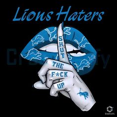 a person holding scissors in their hand with the words lions haters painted on it