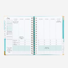 an open planner book sitting on top of a table