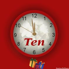 a red clock with the word ten on it's face and presents in front of it