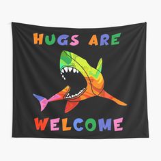 a colorful shark with the words hugs are welcome