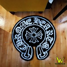 a black and white rug with the words born to dance on it in front of a wooden floor