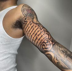 a man with a tattoo on his arm