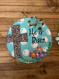 18 inch round Easter HE IS RISEN door hanger! Perfect for Easter time on your front door or hanging on your wall. Painting Galvanized Metal, Spring Porch Decor, Birthday Wreath, Easter Buckets, Round Door Hanger, Staff Gifts, Wood Door Hangers, Easter Season, Easter Cross