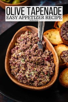 olive tapenade appetizer recipe in a wooden bowl with bread on the side