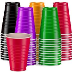 many different colored plastic cups are stacked up on top of each other, with one empty cup in the middle